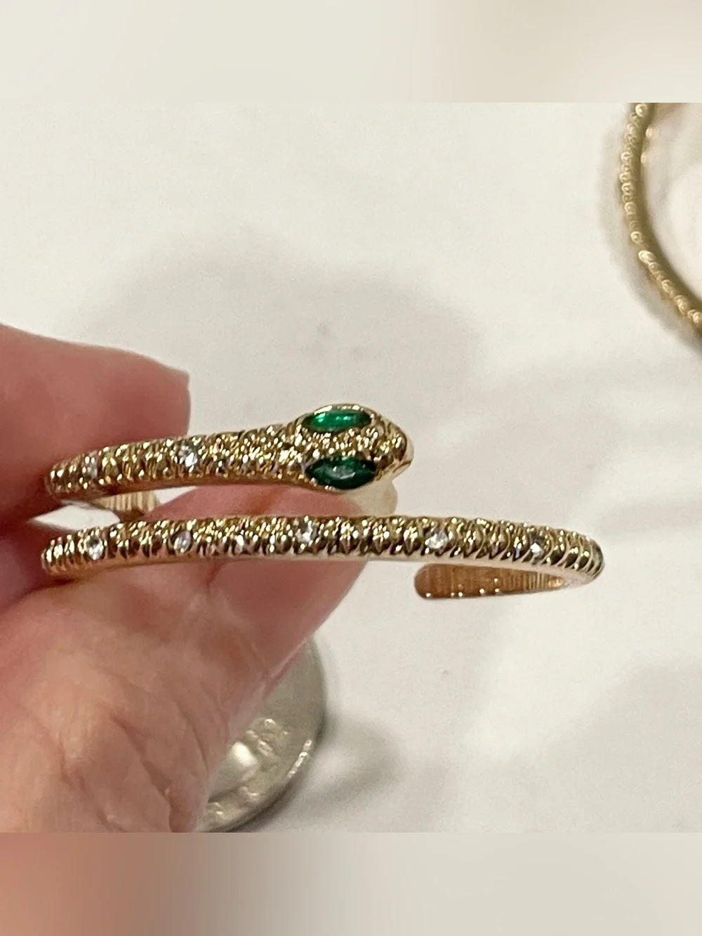 Gold Sparkle Snake Hoop Earrings with Green Eye Stone Accents